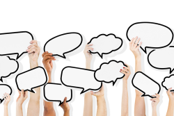 Photo of multiple hands holding different shaped thought bubbles